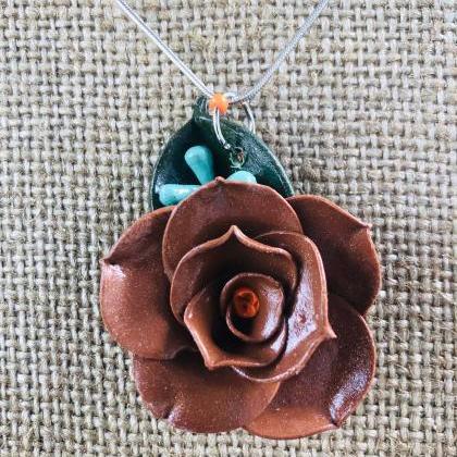 Chocolate Brown Clay Rose With Orange Center..